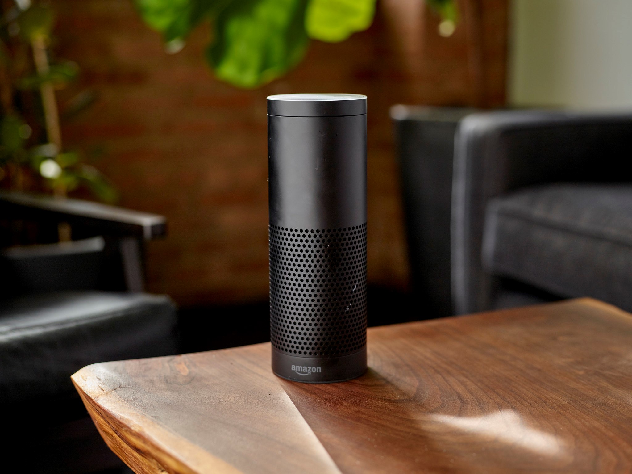 Amazon speaker standing on wooden table